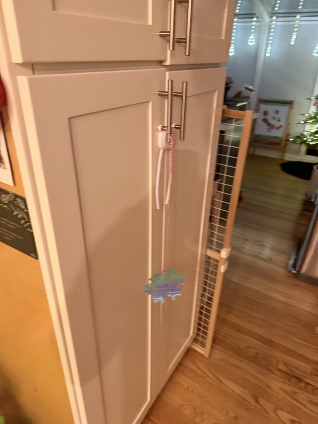 White Kitchen Cabinets with Safety Gate Installation