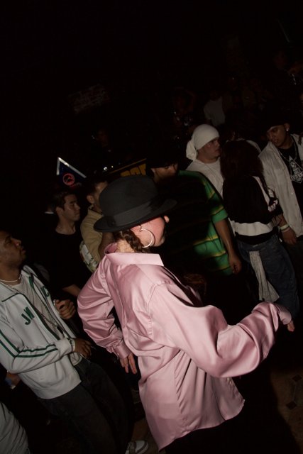 Partygoer in Pink Hat Grooving