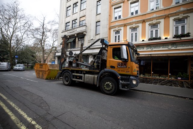 Skip Hire Truck Servicing Urban London Street