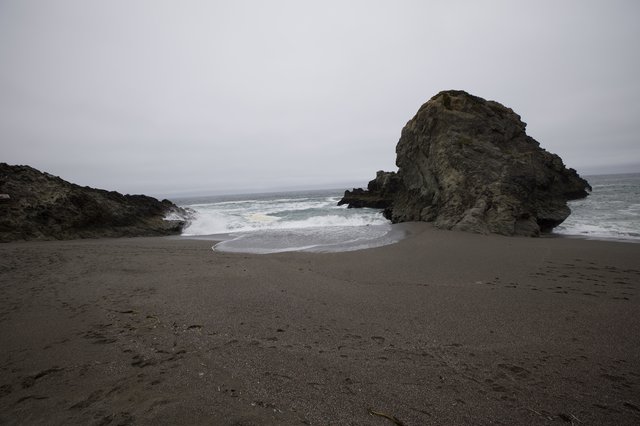 Moody Coastal Cove with Dramatic Sea Stack
