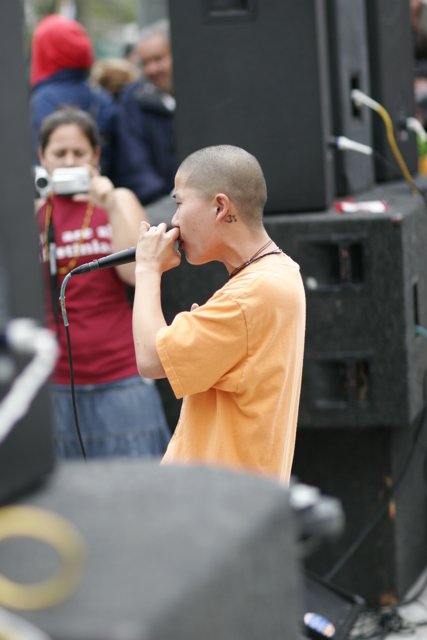 Bald Boy with Mic Takes the Stage