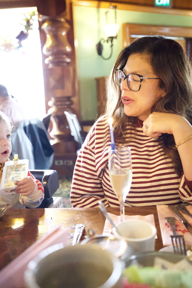 Mother and Child Dining Together at Restaurant