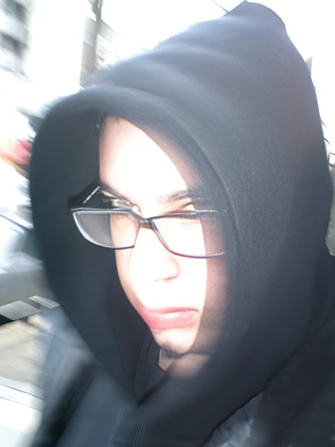 Blurry Portrait of a Woman in a Black Hoodie