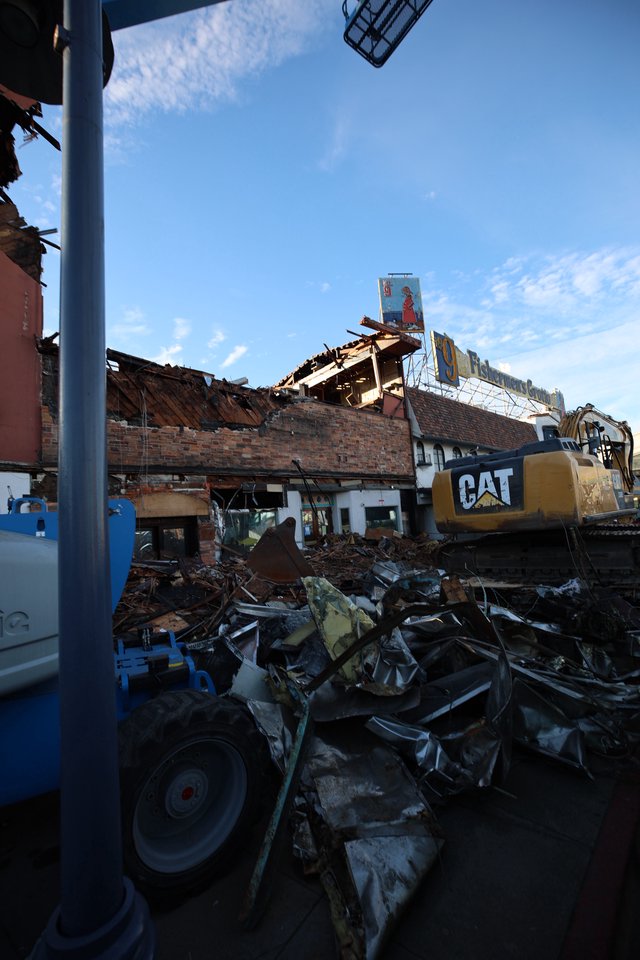 Demolition Site with CAT Excavator Clearing Debris