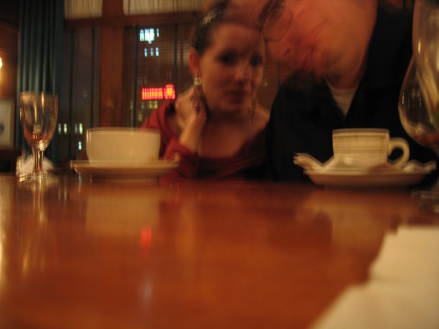 Intimate Couple Sharing a Quiet Café Moment
