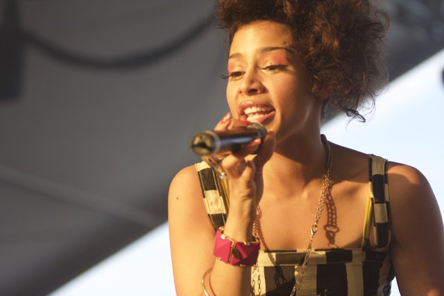 Curly-haired Woman serenade the Crowd at Coachella