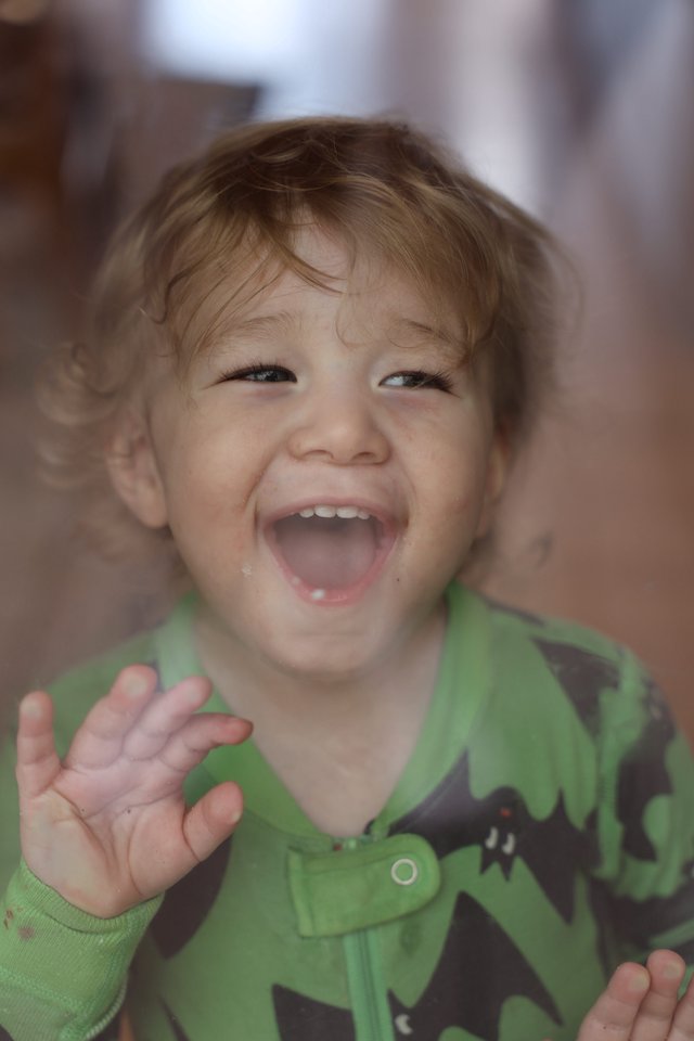 Joyful Toddler with Bright Smile and Messy Hair