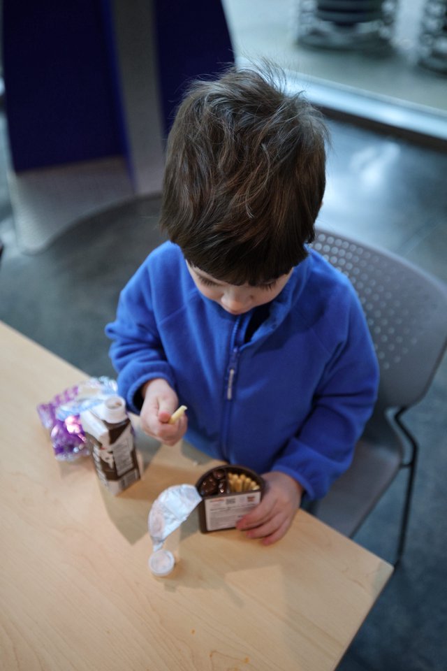 Young Boy Enjoying Snack at Chabot Science Center