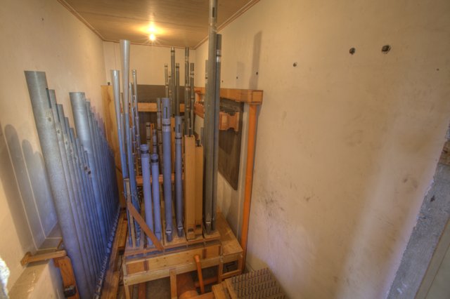 Pipes and Ladder in a Wooden Room