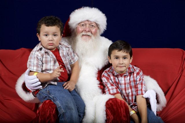 Santa Claus with Two Boys on the Couch
