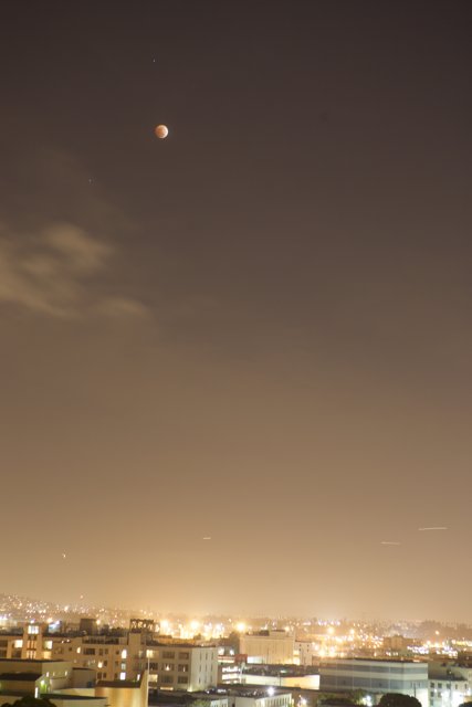 Lunar Eclipse over the Cityscape