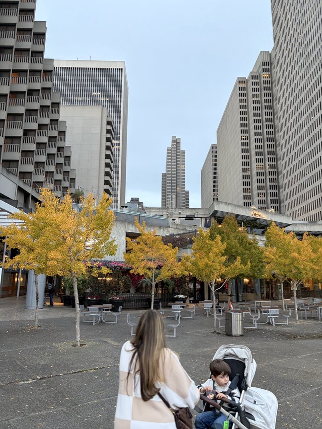 Mother and Child in Modern Urban Plaza