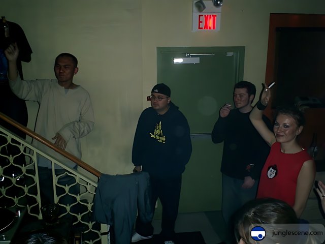 A Group Gathering by the Door