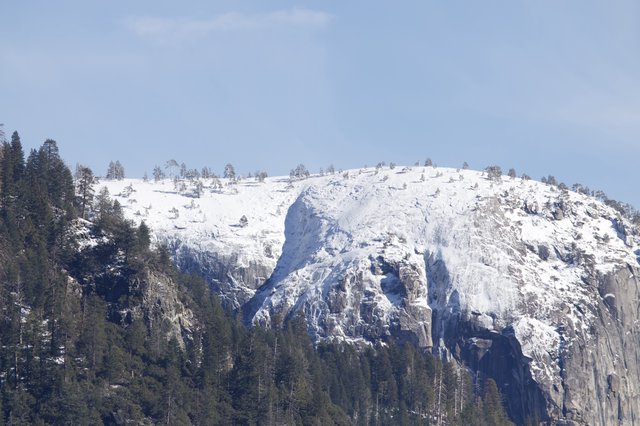 Snow-Covered Granite Dome in Yosemite Valley Winter