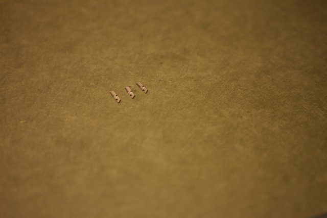 Tiny Screws on a Textured Surface