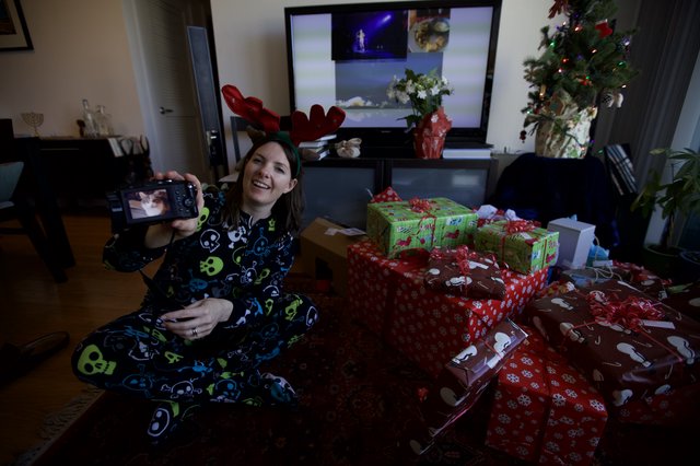 Christmas Morning Selfie with Reindeer Antlers and Presents