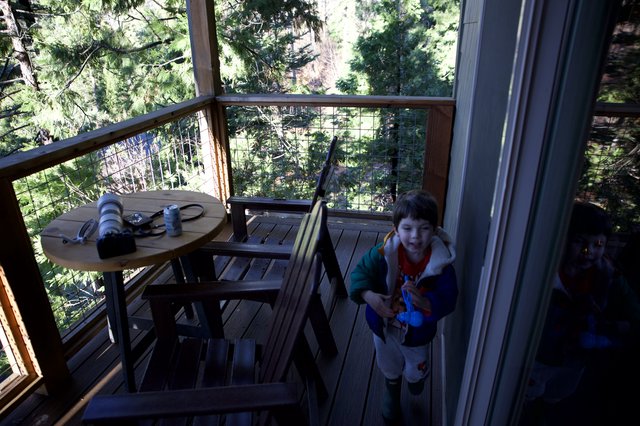 Child Entering Treehouse Deck at Dusk in Yosemite