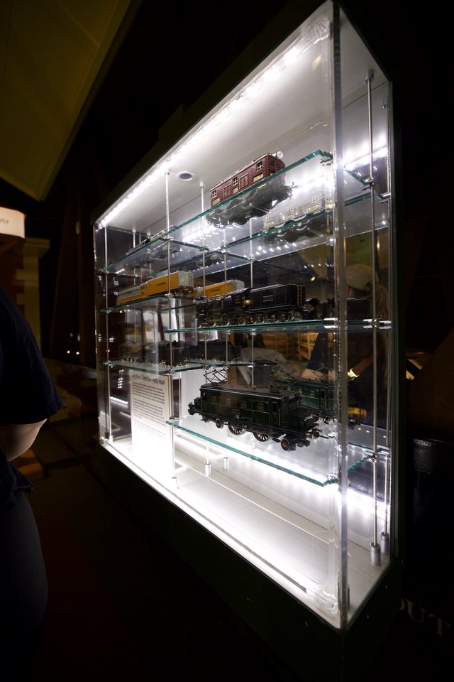 Illuminated Display Case of Model Trains and Locomotives