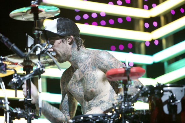 Tattooed Drummer Takes Center Stage