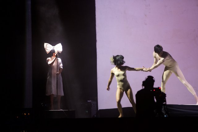 Stage performance with a white sheet