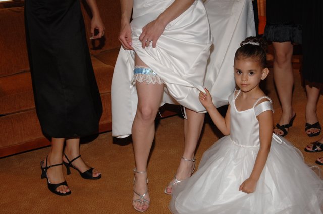 Little Girl in a Formal White Dress and Sandals