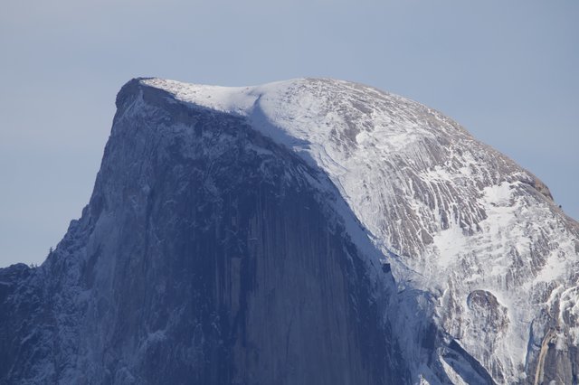 Half Dome's Snow-Covered Summit in Winter Light