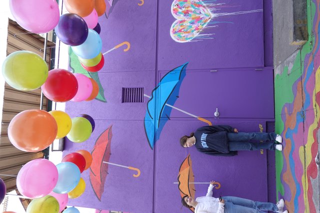 Colorful Balloon Installation with Umbrella Street Art
