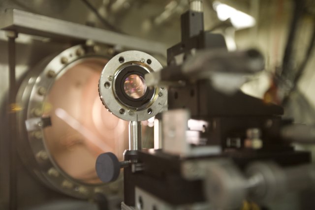 A Close-up of the Camera Lens in a Bustling Lab