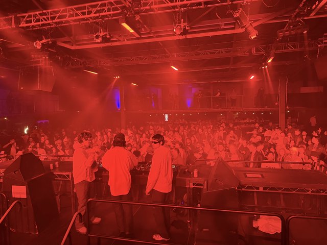Electronic Music Event with Intense Red Stage Lighting