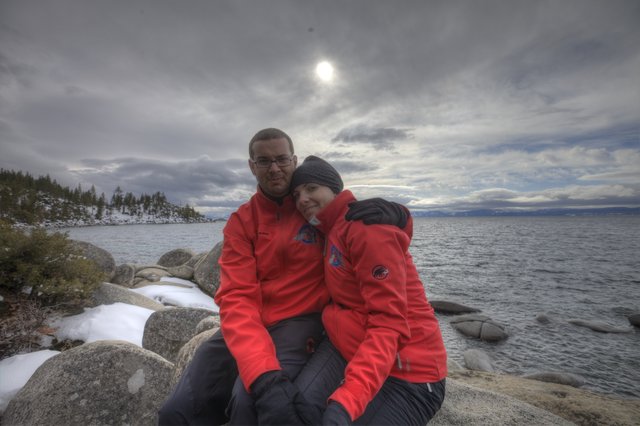 Couple Embracing at Lake Tahoe's Winter Shoreline