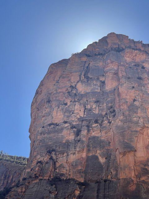 Majestic Cliff Formation Basking in Sunlight