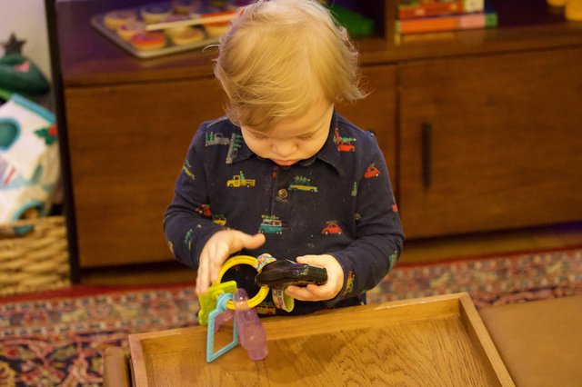 Toddler Playing with Toys on Christmas Eve