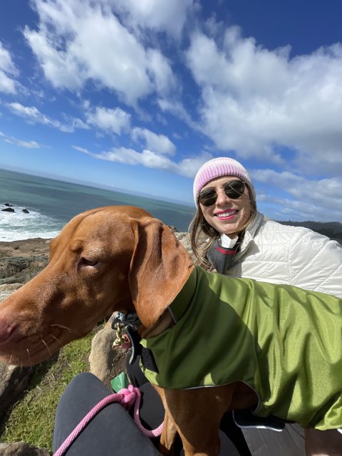 A Woman and Her Four-Legged Friend Overlooking the Pacific