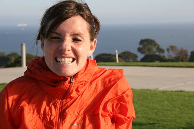 Windswept Woman Smiling by the California Coast