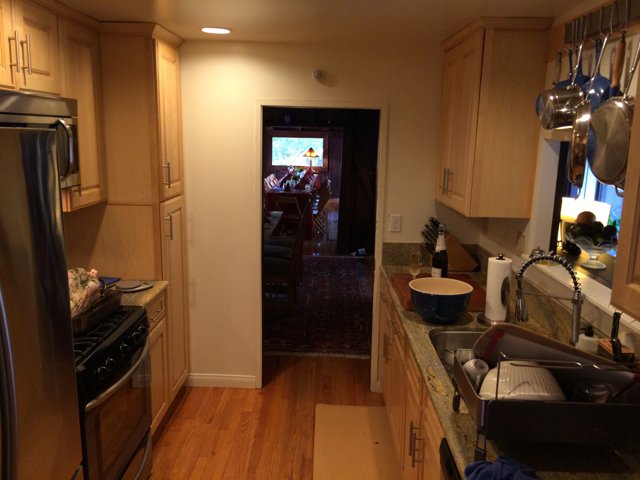 Hardwood Flooring and Dual Sinks Highlight a California Kitchen