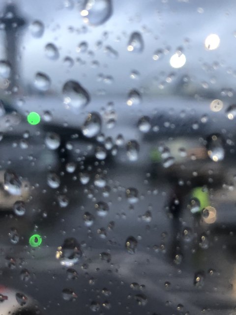 Window View: Raindrops on an Airplane