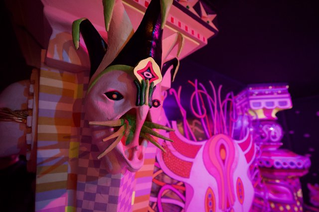 Surreal Pink Illuminated Sculpture in Dark Gallery