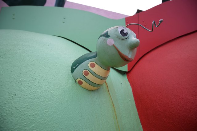 Whimsical Caterpillar Sculpture at Colorful Playground