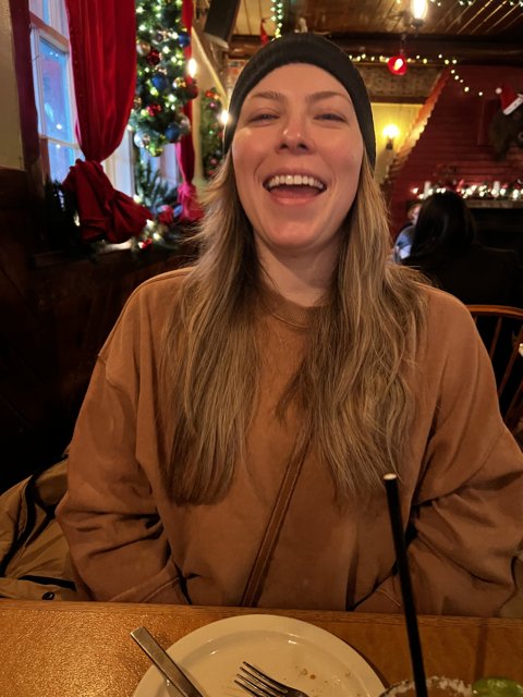 Smiling woman enjoying a festive meal