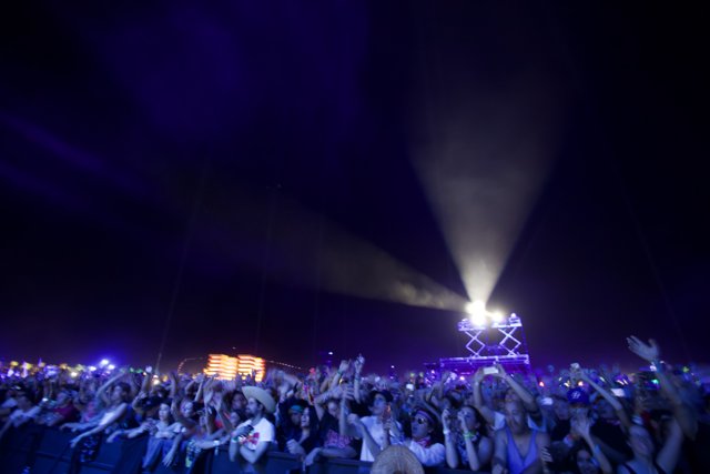 Night Sky Illuminates Thrilled Crowd at Outdoor Concert