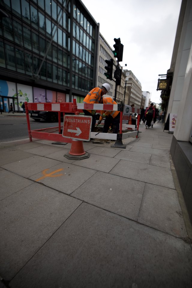 Construction Worker on London Street During Roadwork