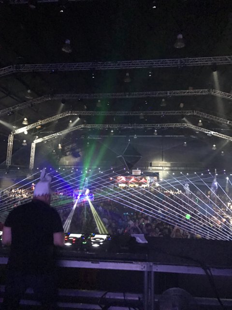 DJ rocks the crowd under the spotlight