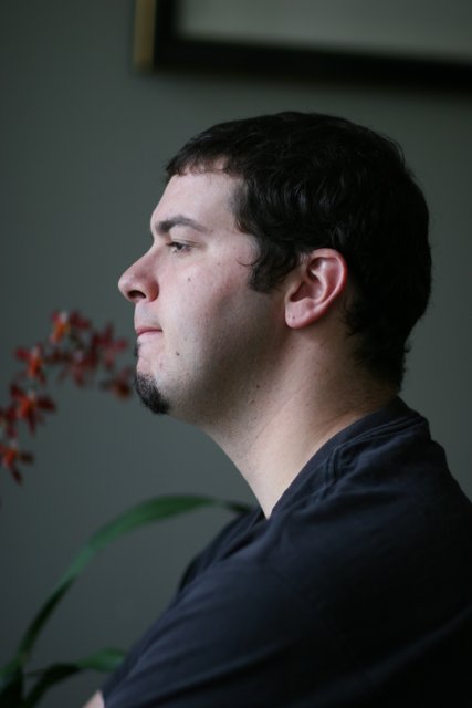 Man with a Black Shirt and a Flower