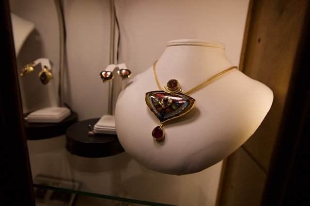 Artisan Jewelry Display with Boulder Opal Pendant Necklace