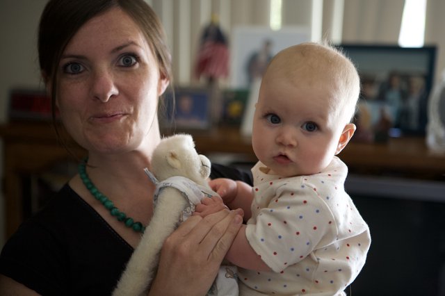 Mother and Baby Share a Playful Moment Indoors
