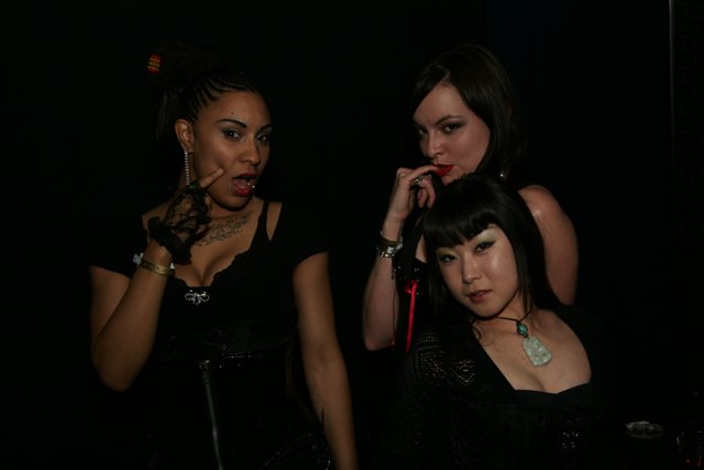 A Trio of Women in Black Strike a Pose