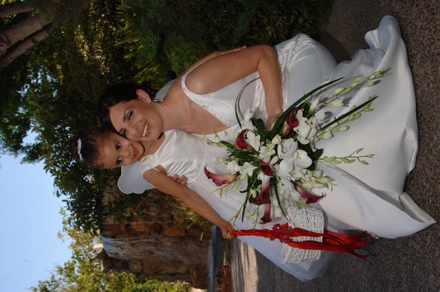 Bride and Flower Girl Share a Tender Wedding Moment