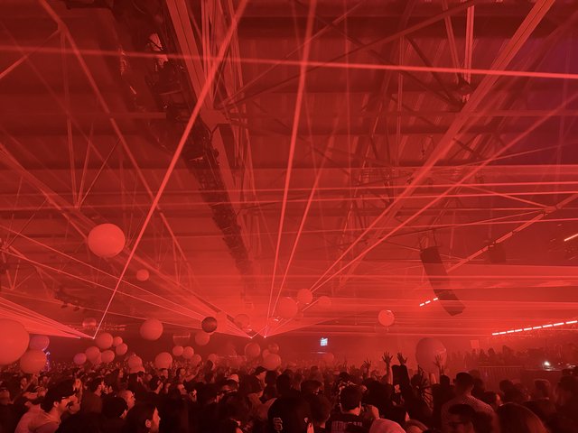 Intense Red Laser Light Show at Electronic Music Concert