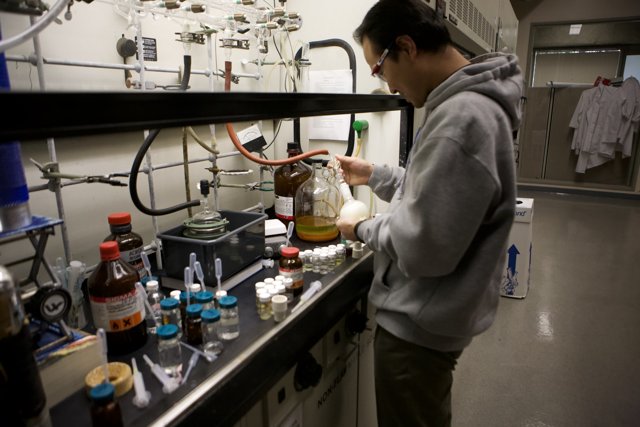 Lab Technician Working on Bottle