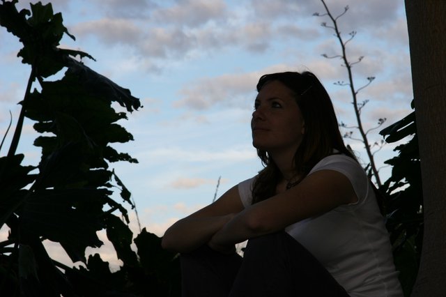 Contemplative Woman Gazing at Twilight Sky